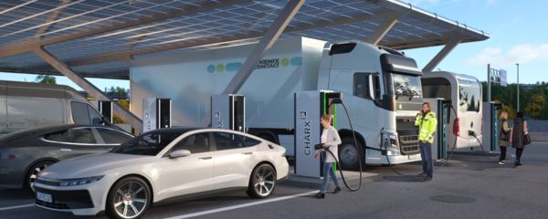 Modern charging park with HPC charging stations where several electric cars, an electric truck, and an electric bus are being charged