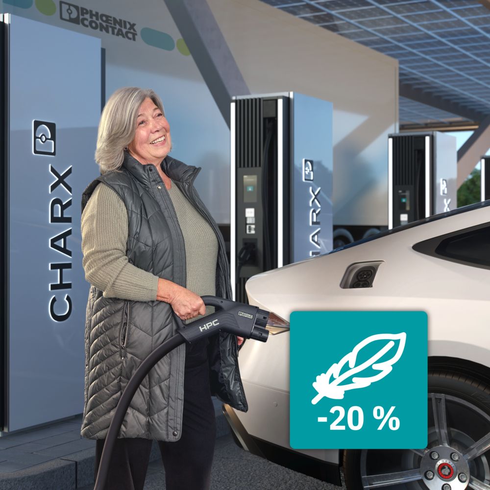 Person charging an electric car at an HPC charging station with a CCS charging connector