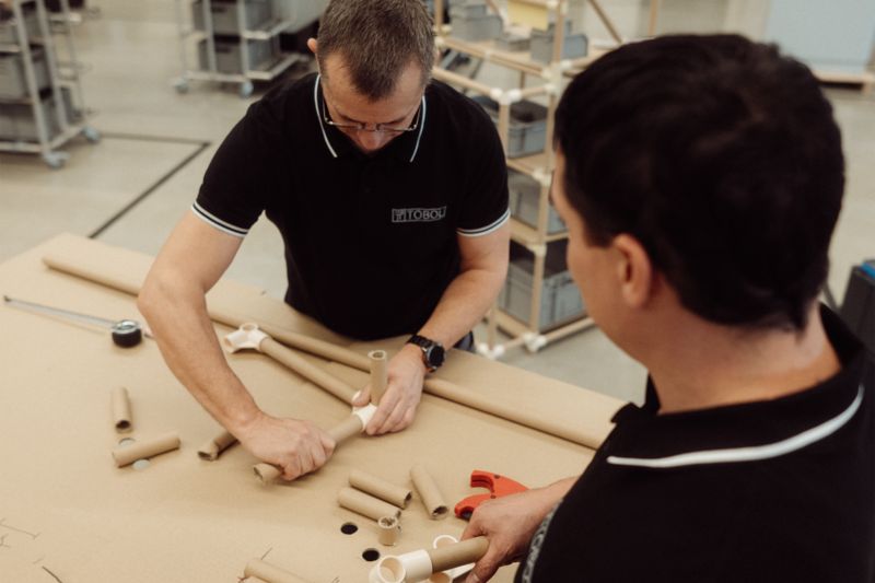 Two employees at the Cardboard Engineering Workshop