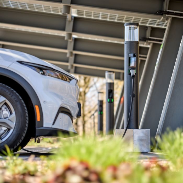 Parking spaces with charging stations for electric cars at the All Electric Society Park