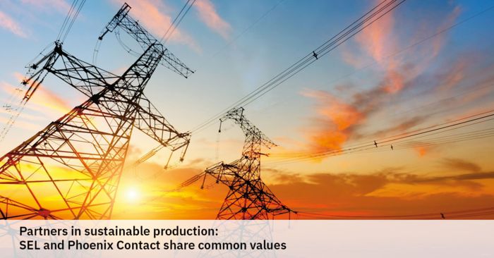 A sunset sky with power cables in the foreground