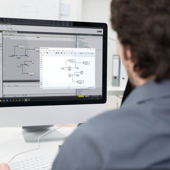 Person at a computer modeling the wind turbine generator 
