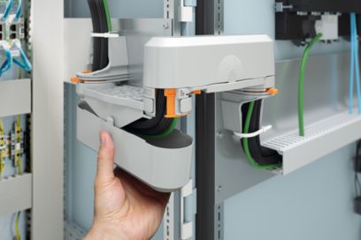Mounting the CGS cable guiding system in the control cabinet door