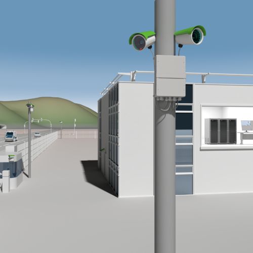 Kameras an einem Mast vor einem Industriegebäude