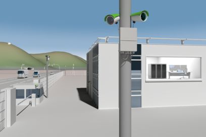 Kameras an einem Mast vor einem Industriegebäude