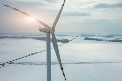 Wind turbine generator against a winter backdrop