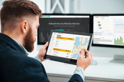 Man using the mGuard Secure Remote Service on a tablet