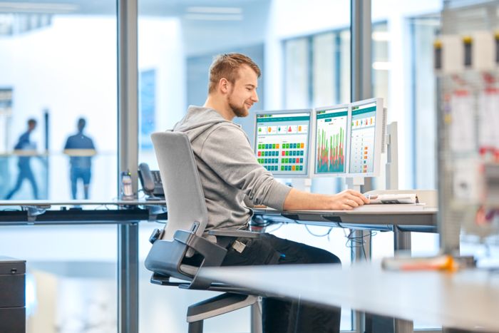 Person in front of monitors with analysis data