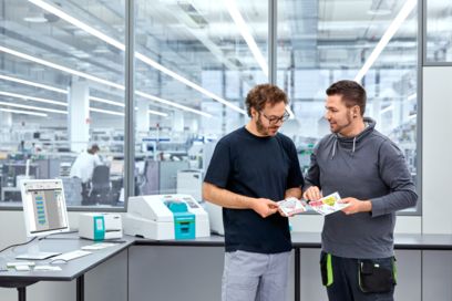 People looking at different marking materials