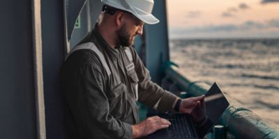 Maritime worker checking computer