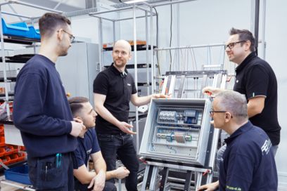 Five people discussing process optimization in the company
