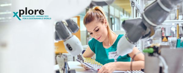 Woman working with a collaborative robot