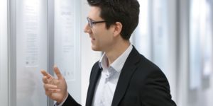 Man examining certificates