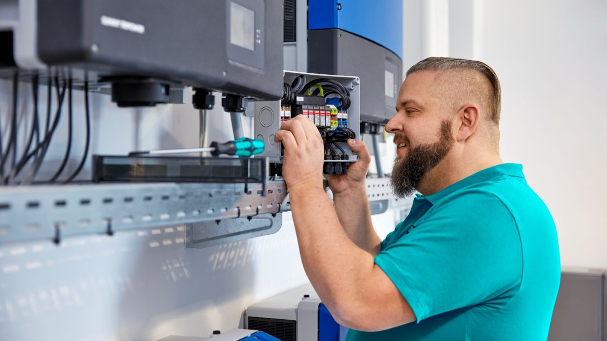 Technician working on a control cabinet