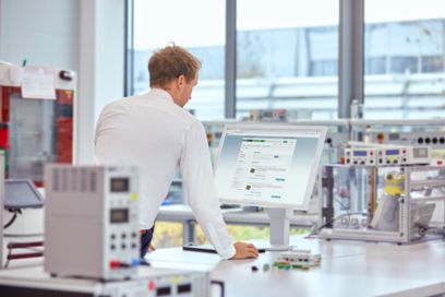 Customer examining a product list on a screen.