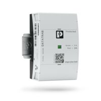 DIN-rail- and wall-mountable surge protection for telecommunications applications installed on a DIN rail