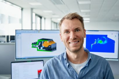 Portrait of a young person at a CAD workstation
