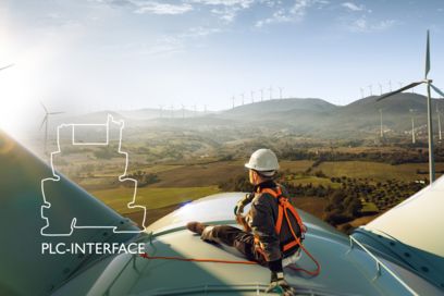 Service personnel on wind turbine with PLC-INTERFACE logo