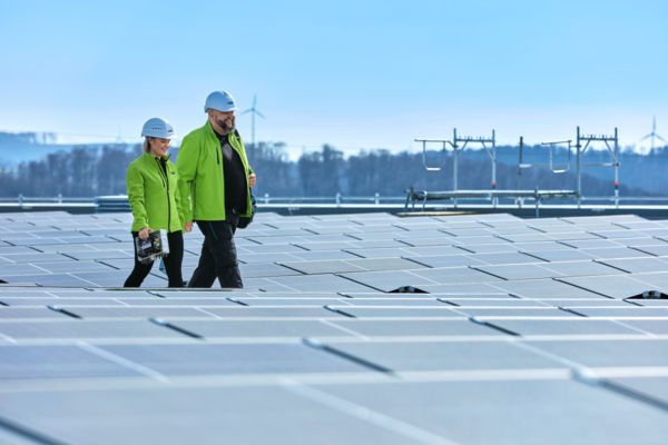 Two electricians in a PV roof installation