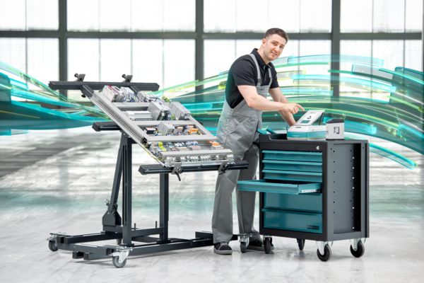 Worker working on a mounting panel