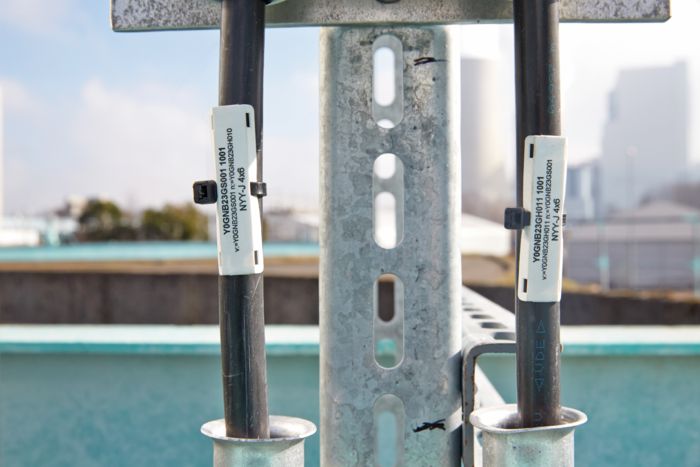 Two cables marked with labels