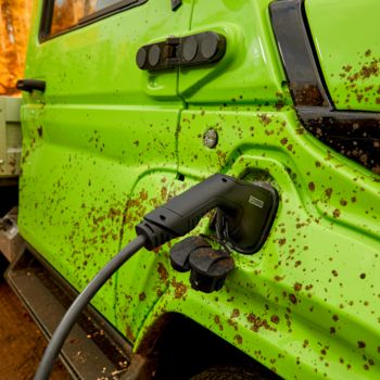 Electric vehicle charging inlet with high IP degree of protection