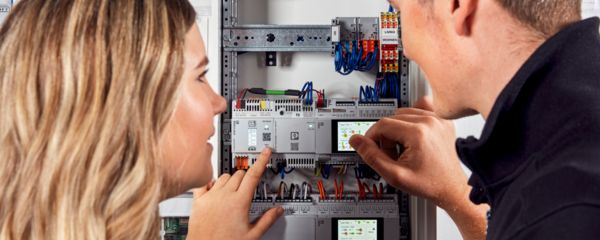 Installer working on a distribution cabinet