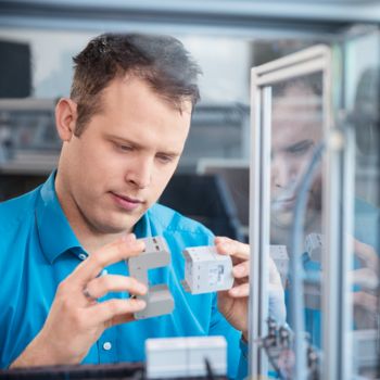 Man working on surge protection product development