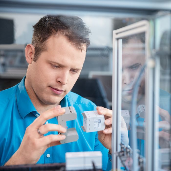 Man working on surge protection product development
