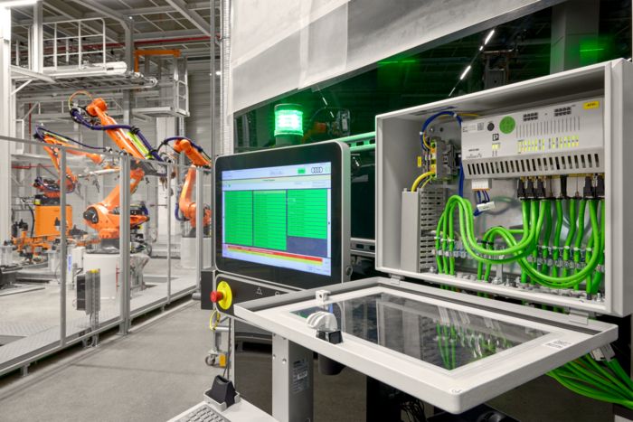 Industrial PCs in use at AUDI PPE in the plant with robots in the background
