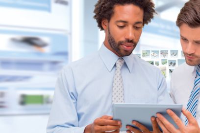 Two men operating the product navigator on a tablet