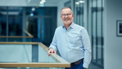 Man with glasses and a blue shirt