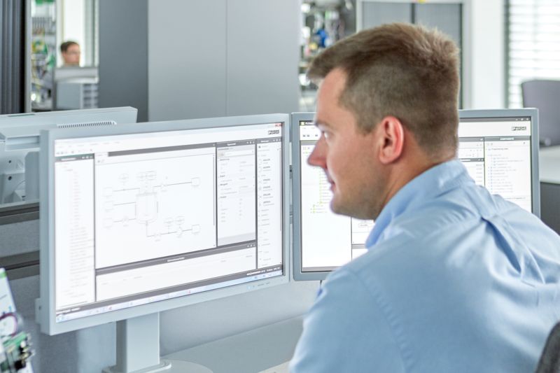 Man operating MTP DESIGNER at desk