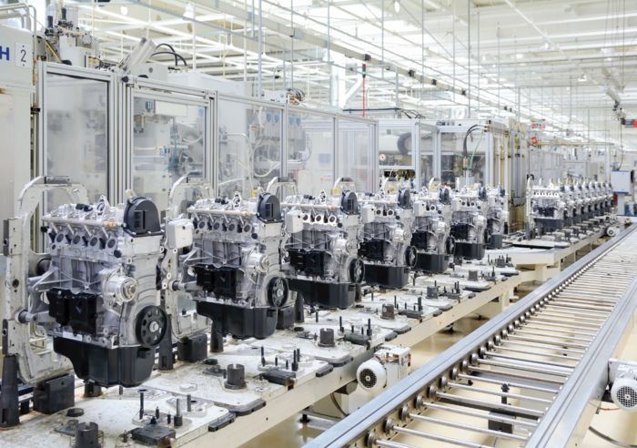 A bright image of an engine assembly line