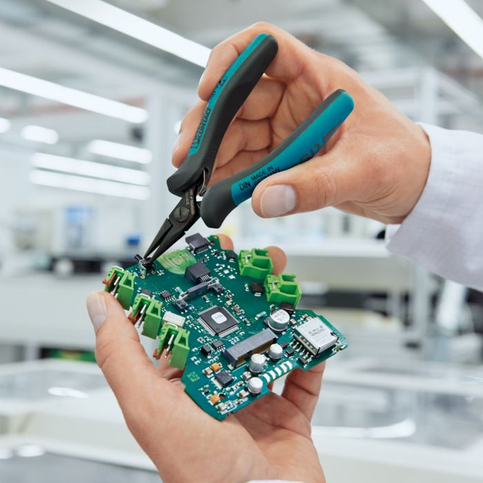 Electronics pliers from the MICROFOX product family in use