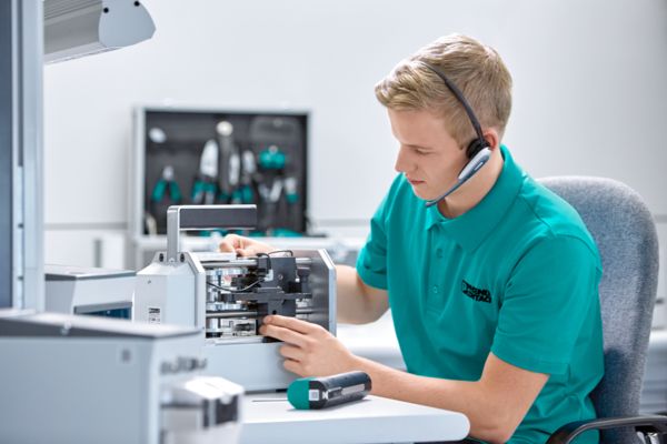 Employee with headset sitting at desk