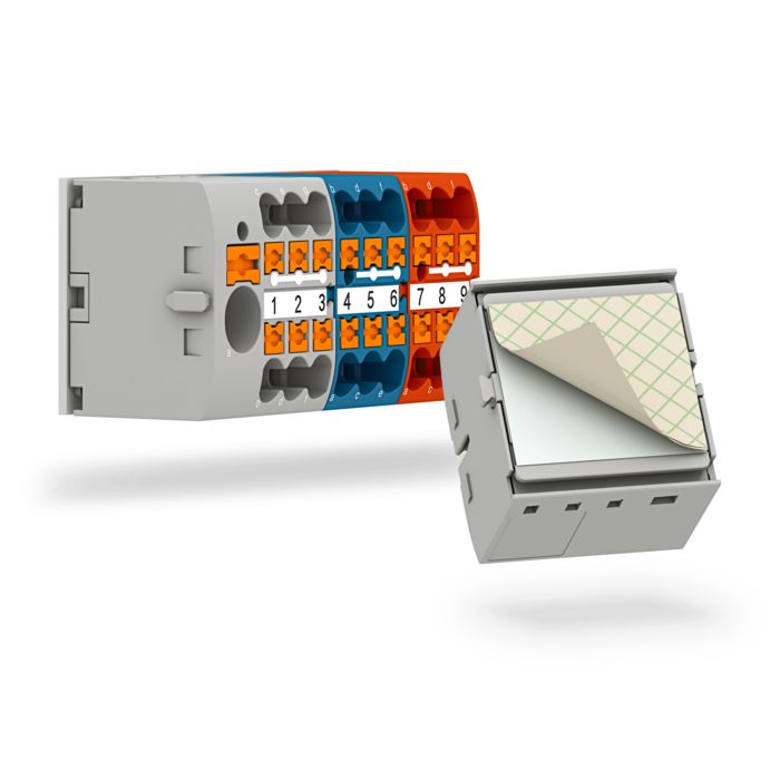 Distribution blocks with adhesive pad for adhesive mounting