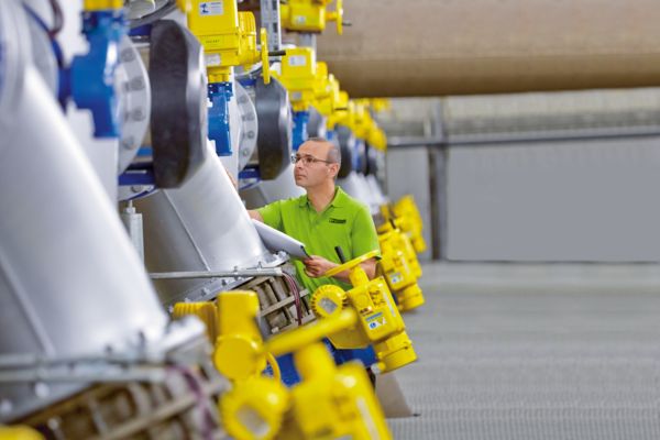 Service employee in the drinking water treatment plant 