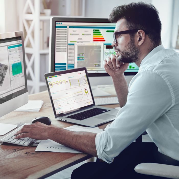 Person looking at Smart Building Cloud data on screens
