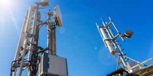 Cell towers against a blue sky