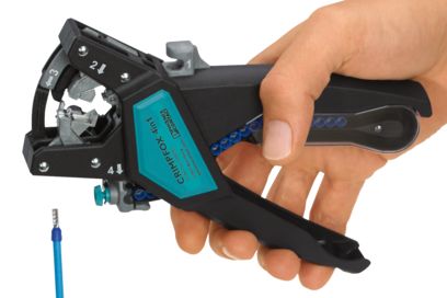 Hand holding the CRIMPFOX 4 in 1 multifunctional crimping tool