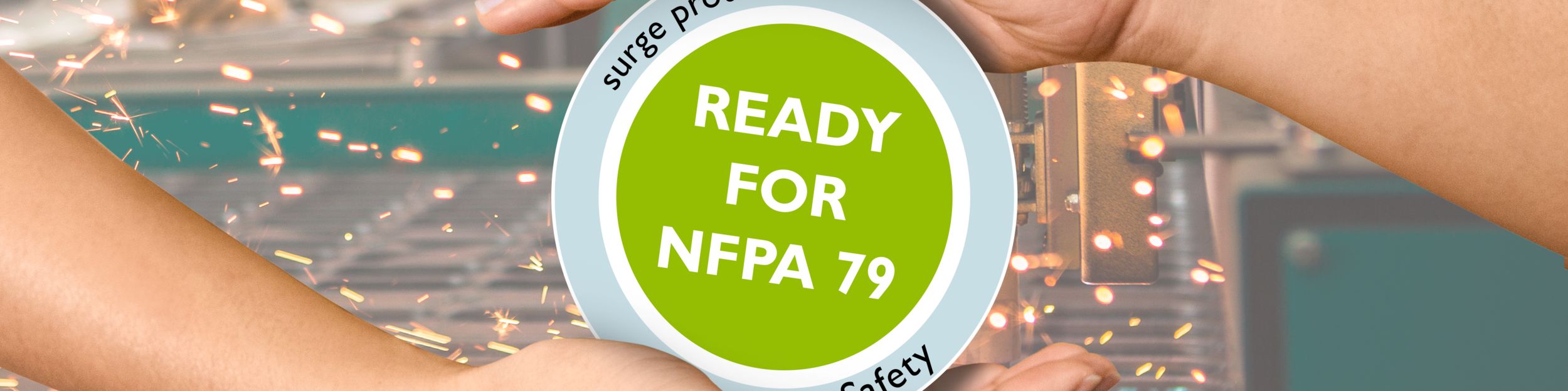 Two hands enclose a button labeled “Ready for NFPA 79” 