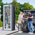Electric car in front of a charging station