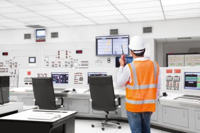 Man in monitoring center with wireless device performing monitoring and diagnostics