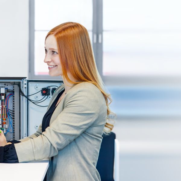 A person working at a workstation with the clipx ENGINEER engineering software