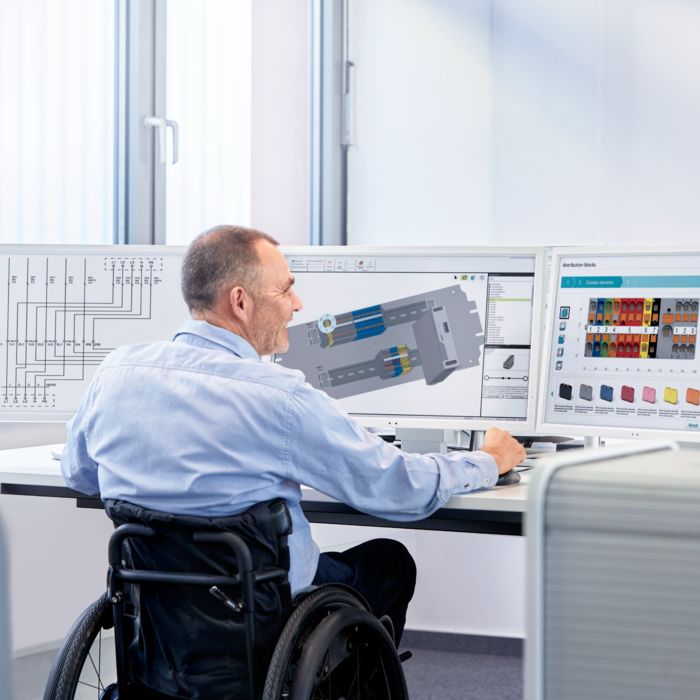 Person in a wheelchair working on a PC with the clipx ENGINEER engineering software