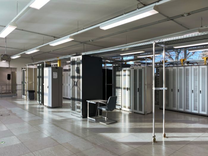 Light-flooded room with several server cabinets