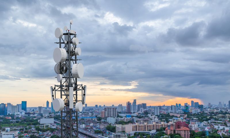 Telecommunications system in front of a cityscape