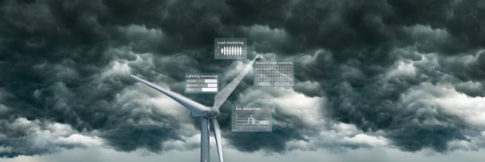 Wind turbine generator against a backdrop of storm clouds with graphic elements