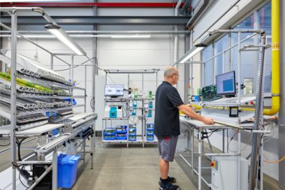 Person in a terminal strip production cell